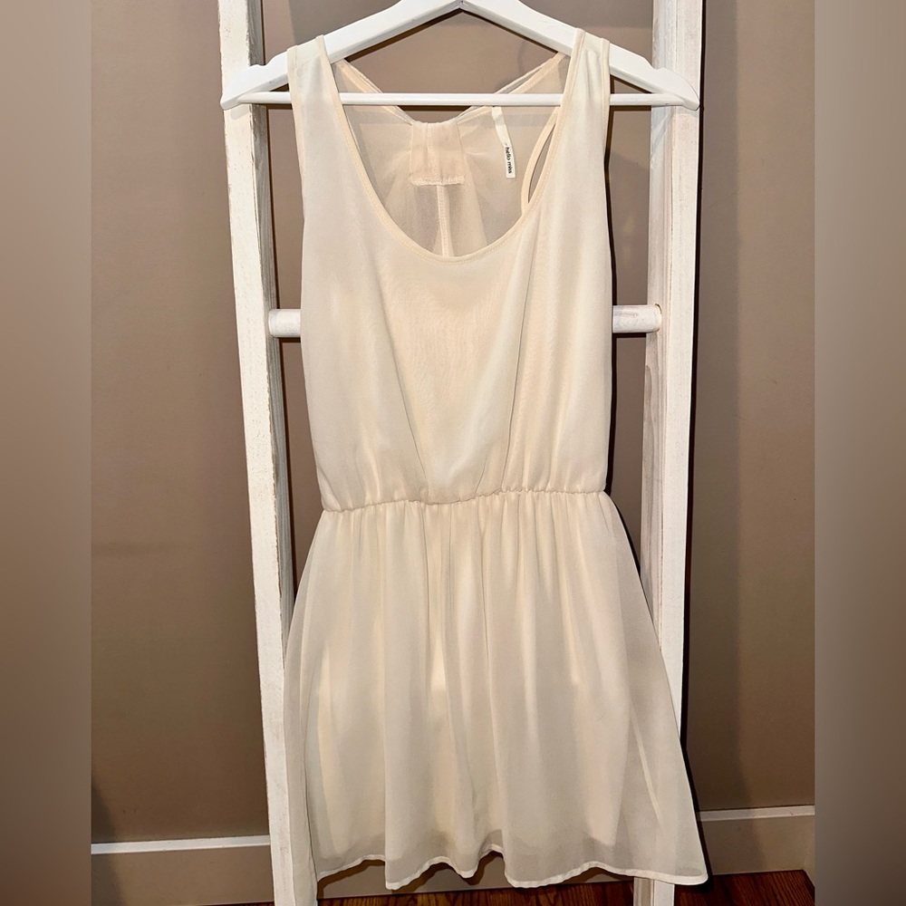 Cream chiffon dress with bow detail on back